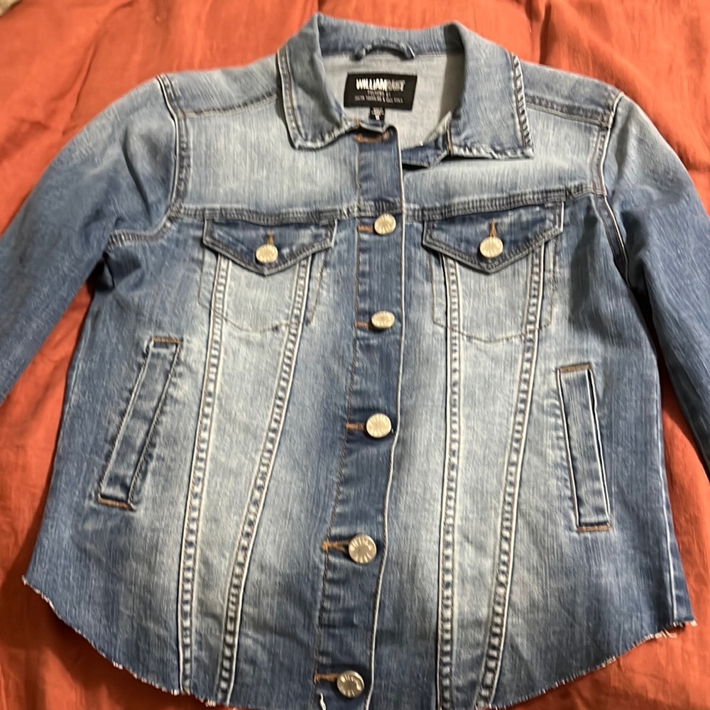 William Rast cropped denim jacket with raw edge.